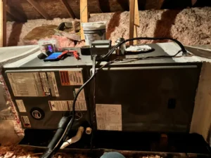 Indoor heat pump air handler unit with access panels removed.