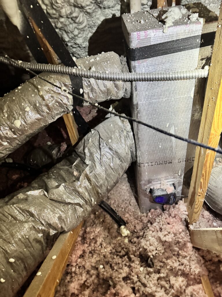 Undersized flexible ductwork connected to a residential HVAC air handler in a South Texas attic